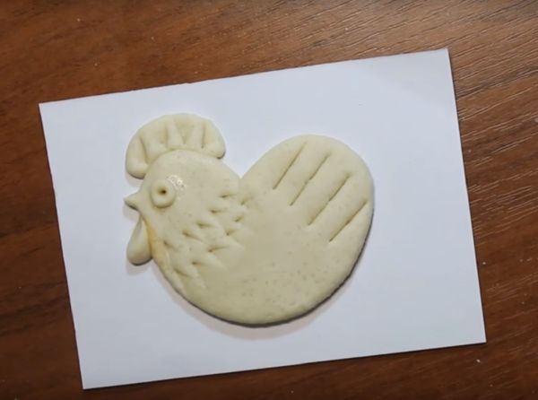 Rooster met zijn eigen handen